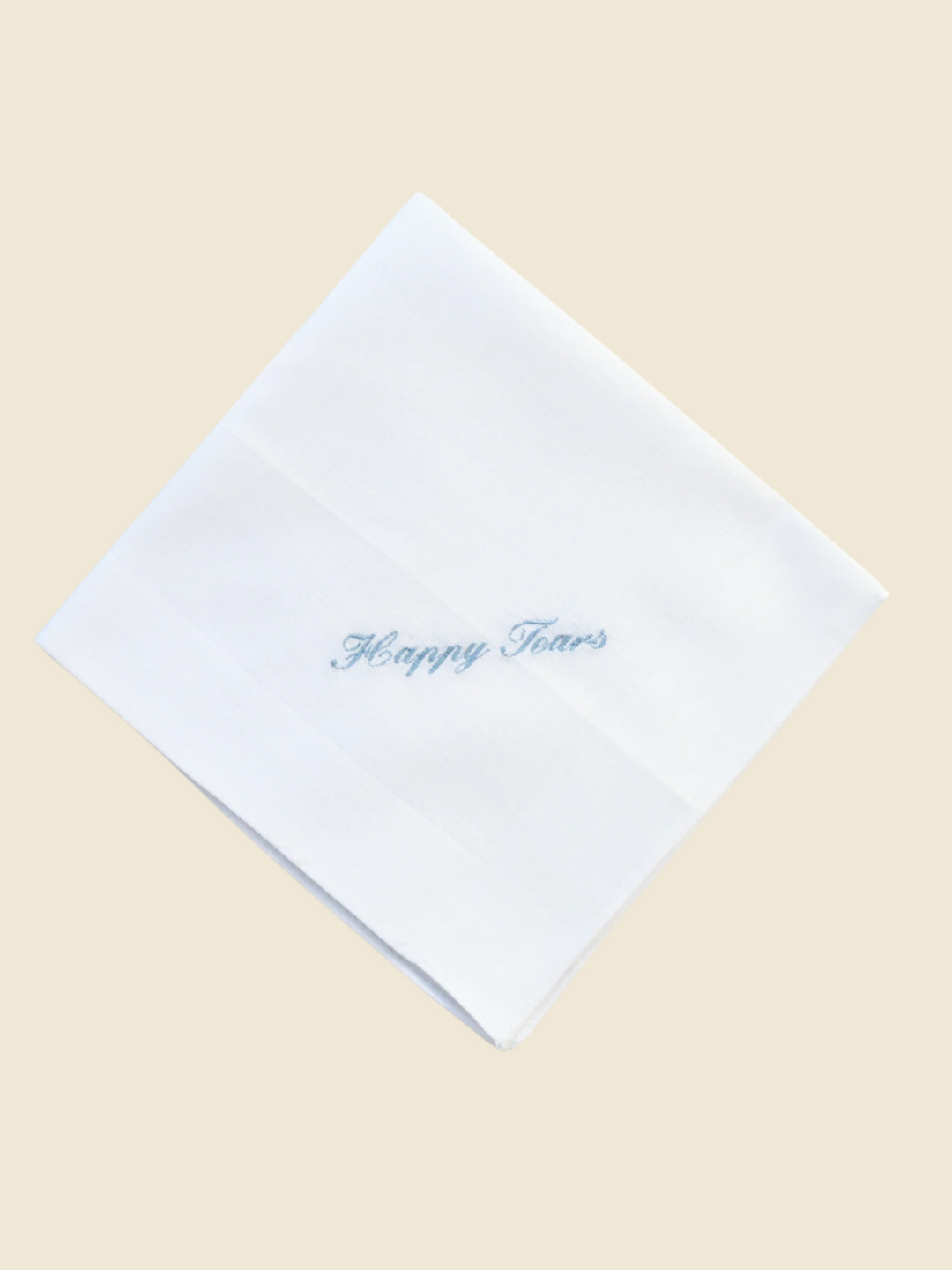 Wedding napkin with text Happy Tears embroidered in blue thread