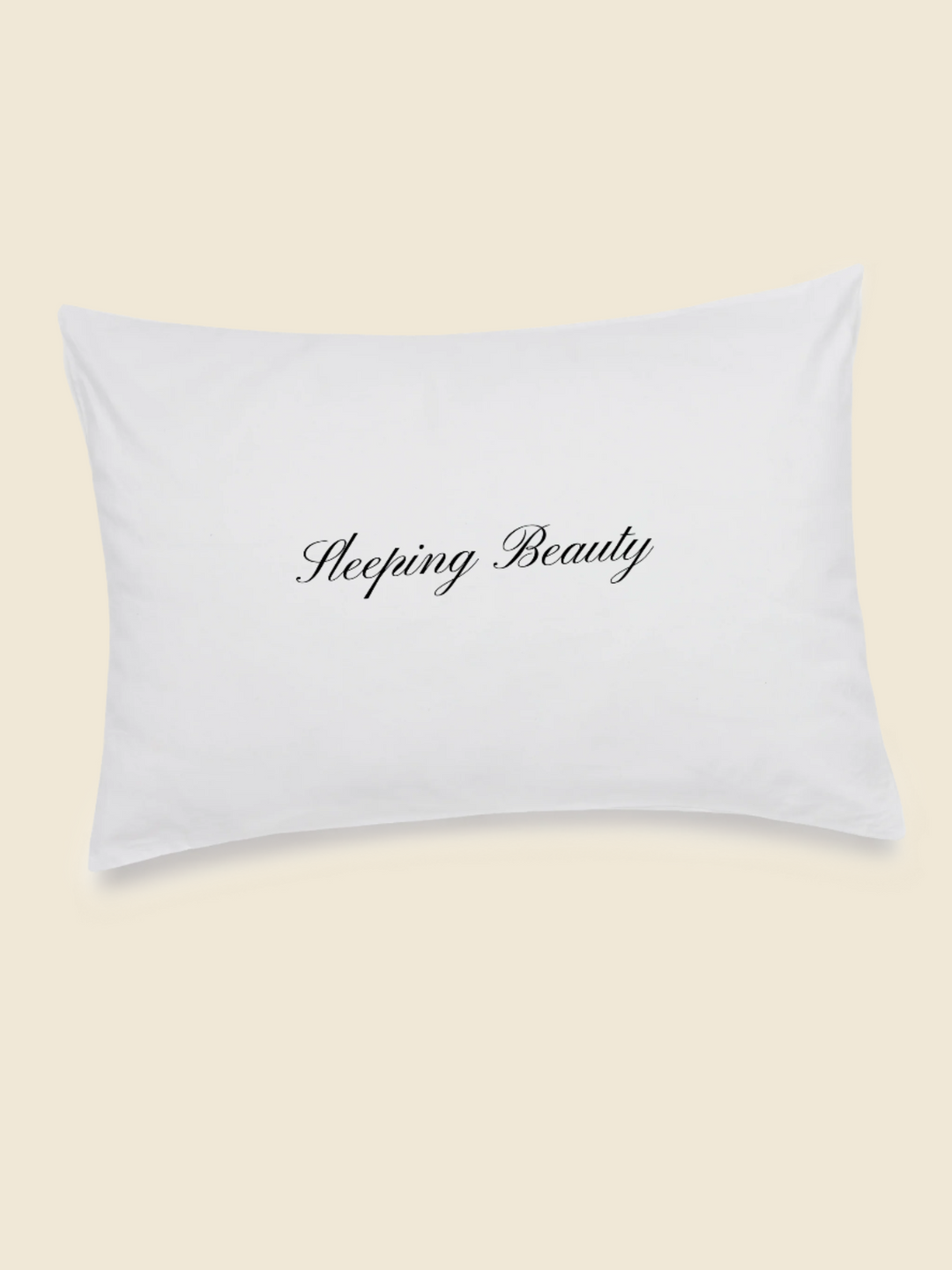 white pillowcase with black embroidered text saying sleeping beauty in the centre