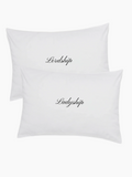white pillowcase set with embroidered words in black saying Lordship and Ladyship