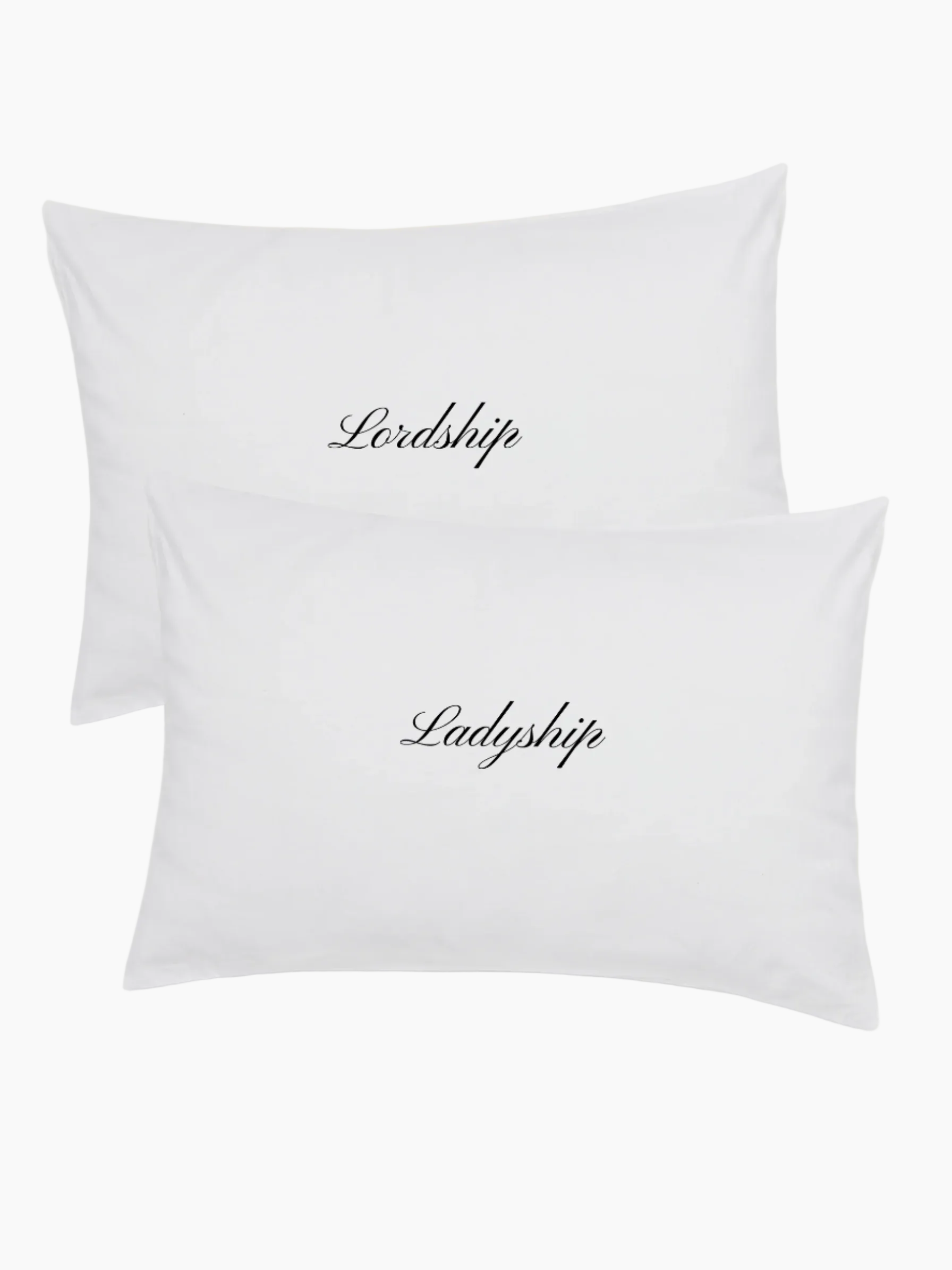 white pillowcase set with embroidered words in black saying Lordship and Ladyship